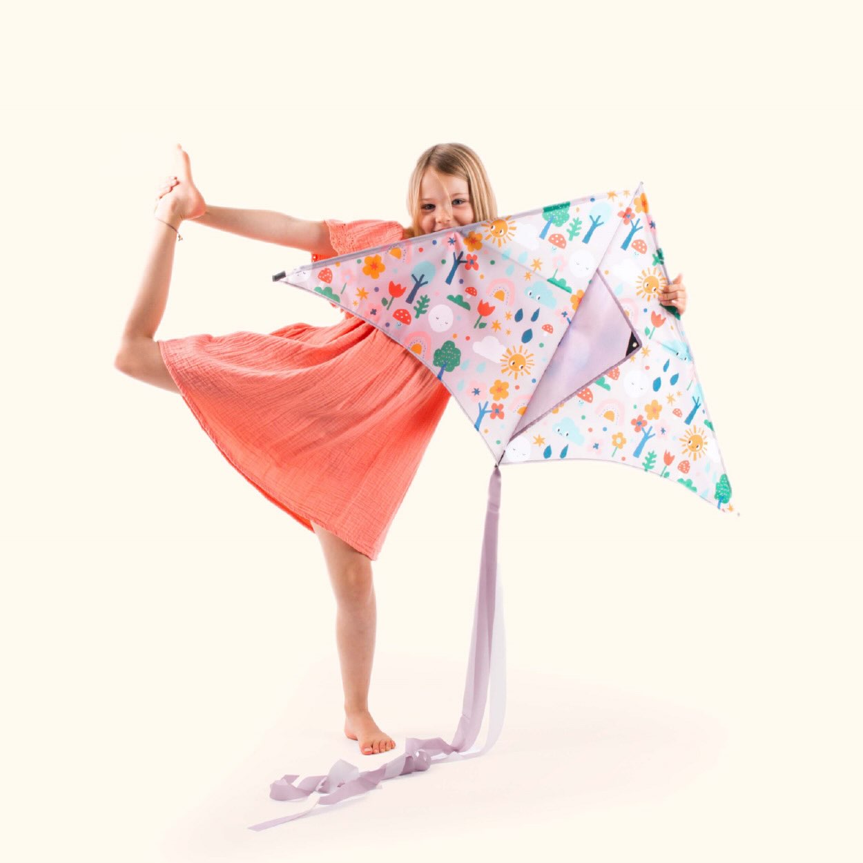 Girl playing with Happy Days kite